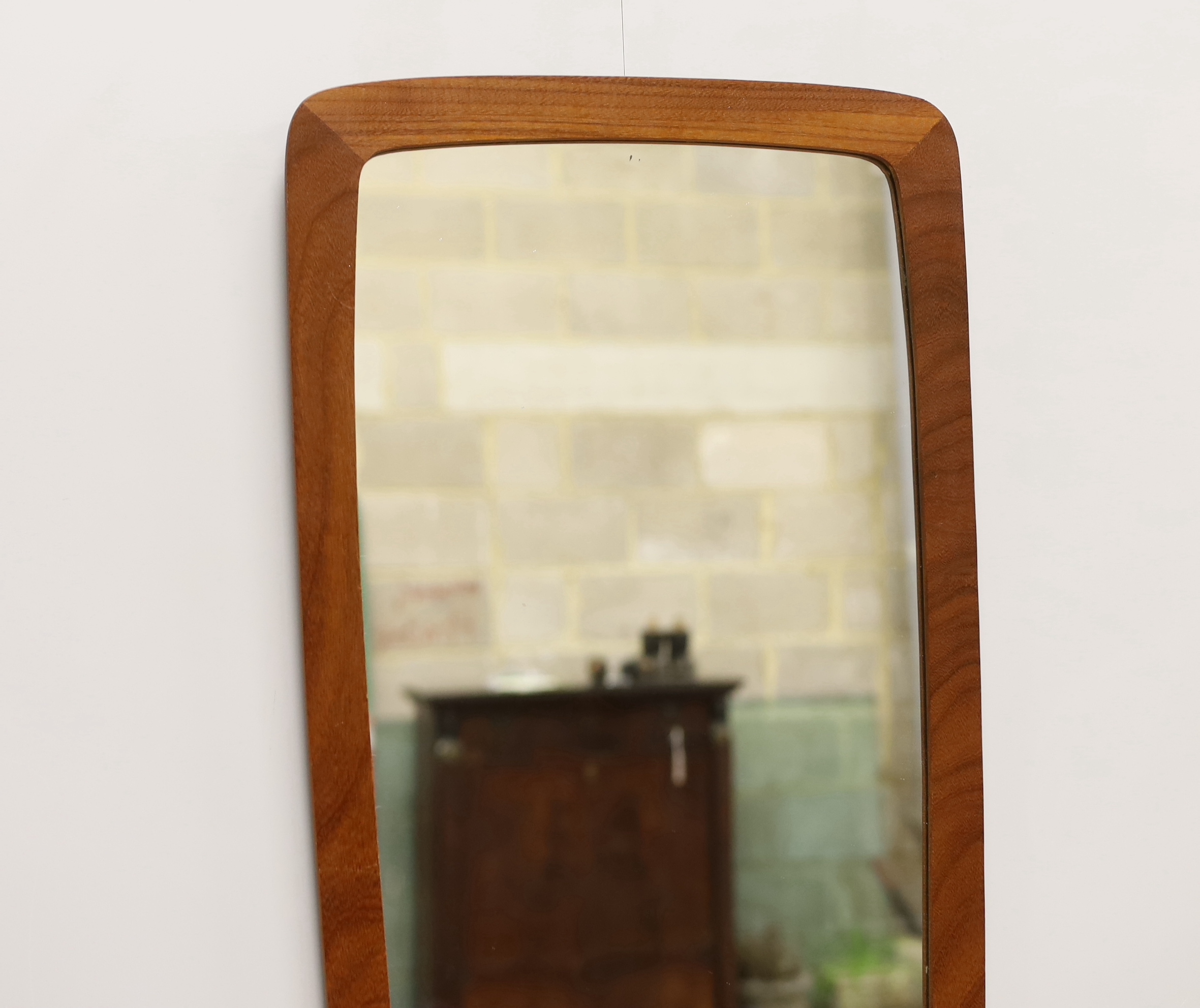 A mid-century teak framed wall mirror, width 36cm, height 76cm